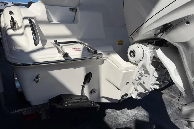 Slide: The Image of 2026 Key West 239 FSR boat stern with ladder and outboard motor. - 9
