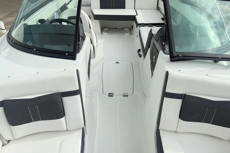 Slide: The Image of 2022 Monterey M-225 boat interior with white and black seating, sleek design. - 10