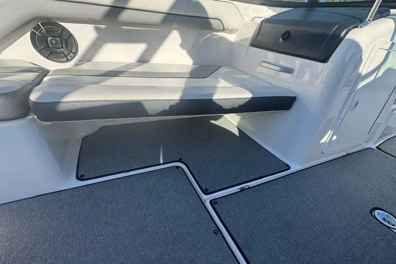 Slide: The Image of 2018 Yamaha AR195 boat interior with seating and speaker. - 11