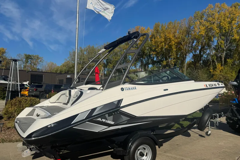 Slide: The Image of 2018 Yamaha Boats AR195 on trailer, rear view, sunny day, outdoor setting. - 6