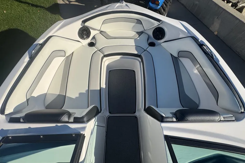 Slide: The Image of 2018 Yamaha Boats AR195 interior seating area with sleek, modern design and comfortable upholstery. - 8