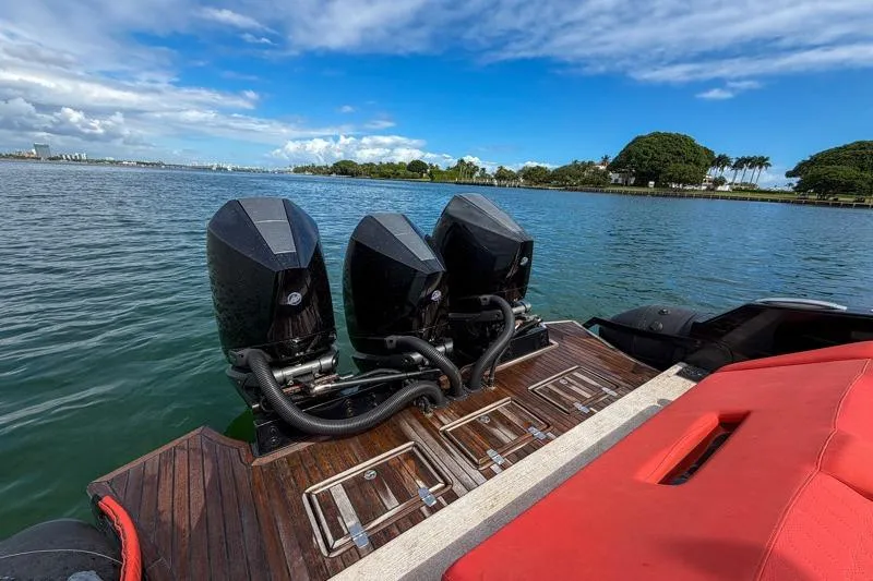 Slide: The Image of 2023 Skipper-BSK 42NC boat with triple outboard engines on a sunny day. - 10