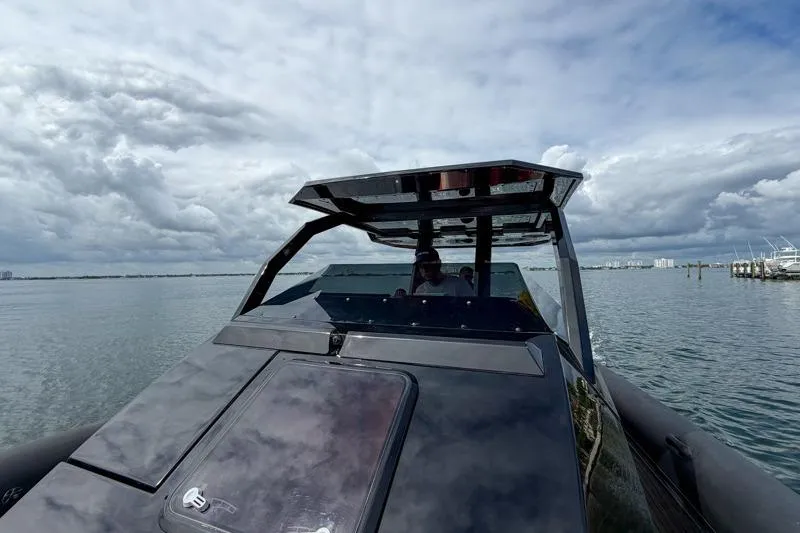 Slide: The Image of 2023 Skipper-BSK 42NC boat on calm water under cloudy sky. - 24
