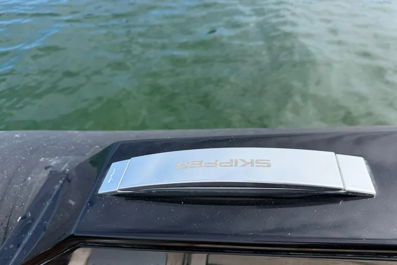 Slide: The Image of Skipper-BSK 42NC boat detail, 2023 model, on calm water. - 6