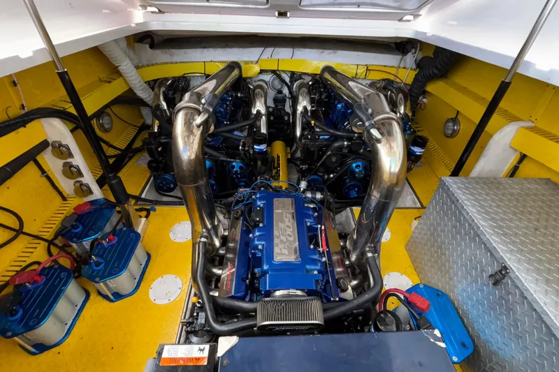 Slide: The Image of Engine compartment of a 2002 Donzi 45 ZX boat, featuring powerful dual engines. - 20