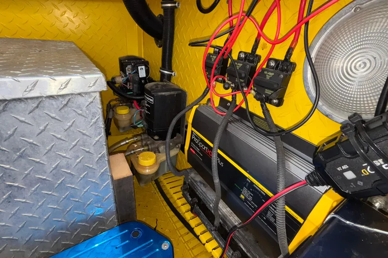 Slide: The Image of Engine compartment of a 2002 Donzi 45 ZX boat with wiring and components. - 24