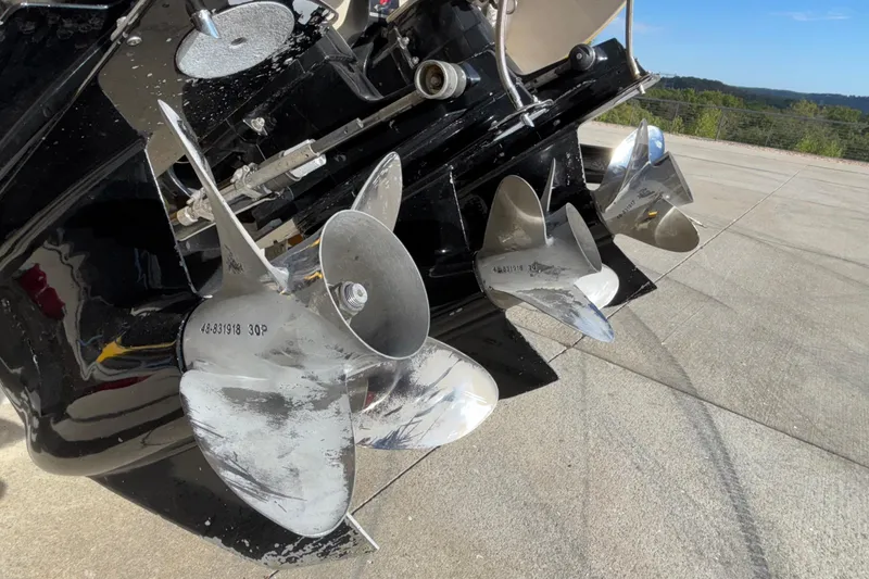 Slide: The Image of Propellers of a 2002 Donzi 45 ZX boat on a concrete surface. - 45
