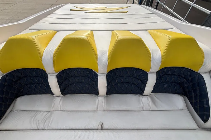 Slide: The Image of 2002 Donzi 45 ZX boat seating with yellow and white upholstery. - 7