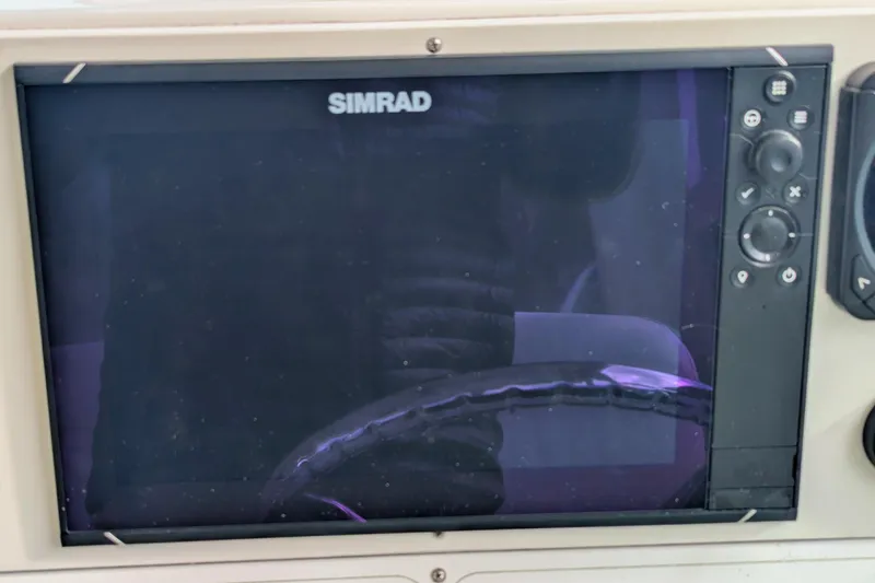 Slide: The Image of Simrad display on 2002 Stamas 340 Express boat dashboard. - 20