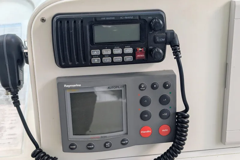 Slide: The Image of VHF marine radio and Raymarine autopilot on 2002 Stamas 340 Express boat. - 21