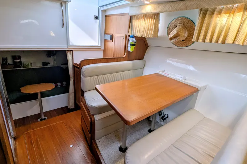 Slide: The Image of 2002 Stamas 340 Express cabin interior with dining area and seating. - 24