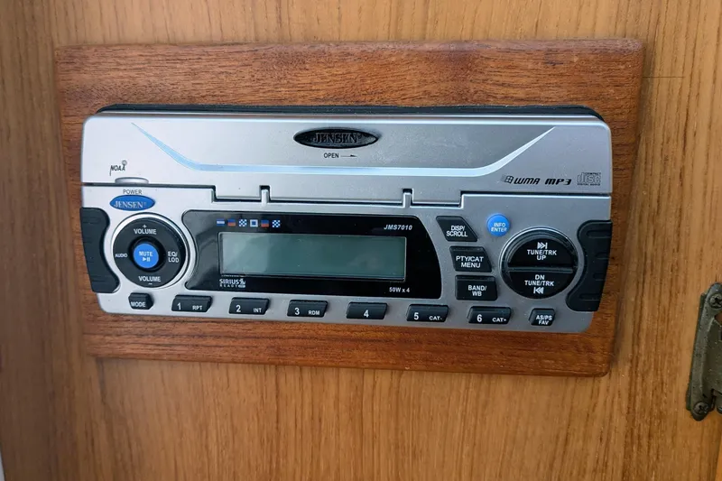 Slide: The Image of Jensen stereo system on 2002 Stamas 340 Express boat, mounted on wooden panel. - 36