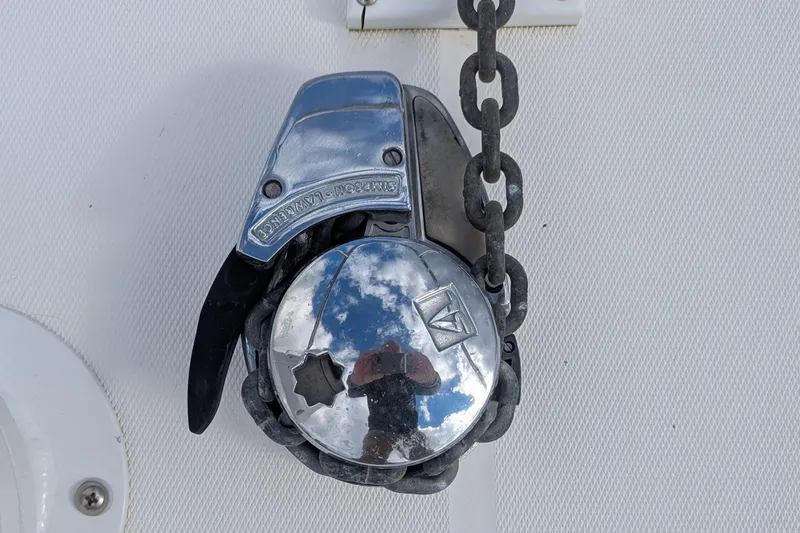 Slide: The Image of Chrome anchor windlass on 2002 Stamas 340 Express boat deck. - 38