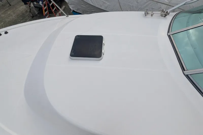 Slide: The Image of 2002 Stamas 340 Express boat deck with hatch and windshield. - 41