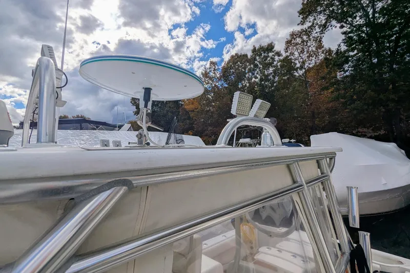 Slide: The Image of 2002 Stamas 340 Express boat with radar and lights, under a partly cloudy sky. - 43
