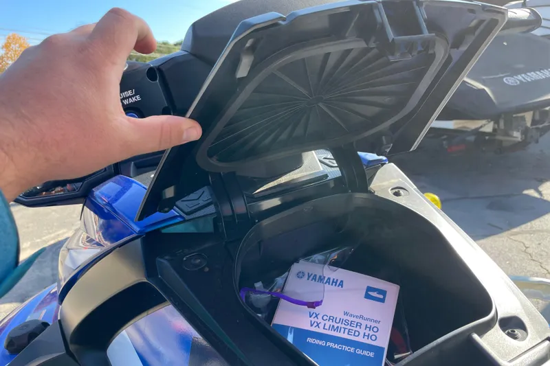 Slide: The Image of 2024 Yamaha WaveRunner VX Cruiser HO storage compartment with manual inside. - 10