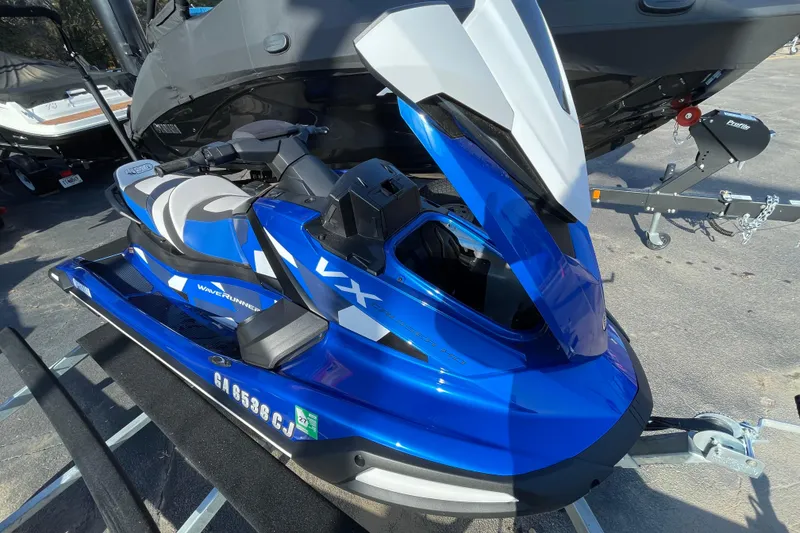 Slide: The Image of 2024 Yamaha WaveRunner VX Cruiser HO in blue, parked on a trailer. - 2