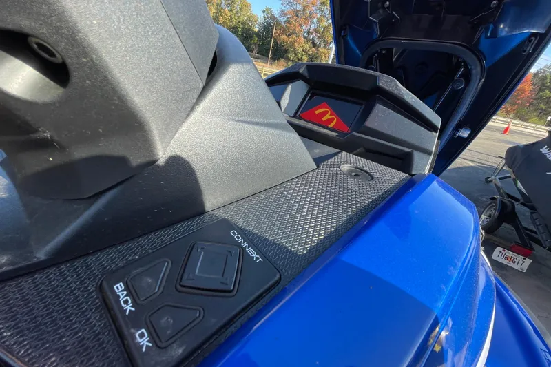 Slide: The Image of 2024 Yamaha WaveRunner VX Cruiser HO dashboard with control buttons and storage compartment. - 7