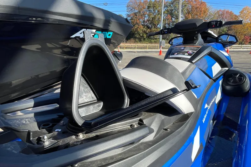 Slide: The Image of 2024 Yamaha WaveRunner VX Cruiser HO with open storage compartment, blue and black design. - 9