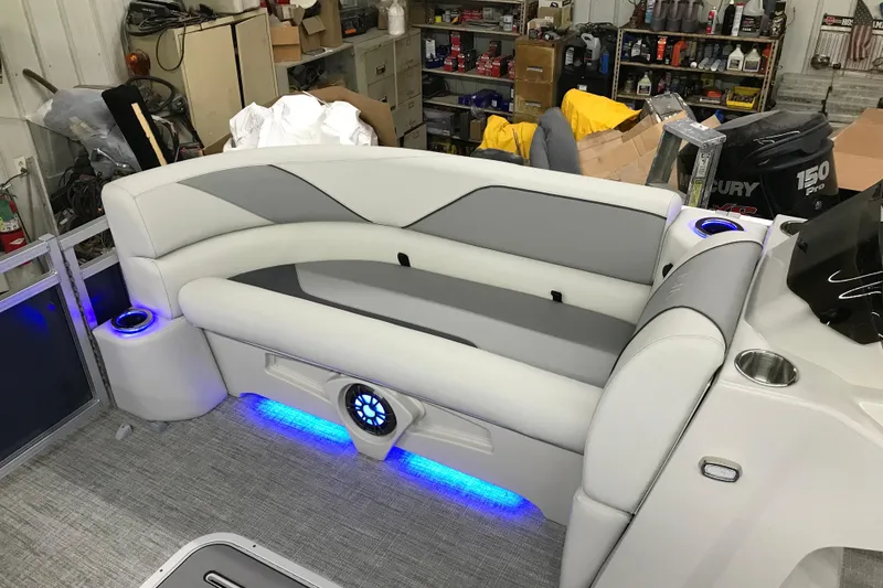 Slide: The Image of 2026 Avalon Venture 85 Versatile rear bench with LED lighting in a workshop setting. - 11