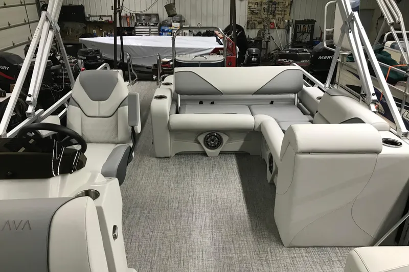 Slide: The Image of 2026 Avalon Venture 85 Versatile Rear Bench boat interior with modern seating and steering console. - 8