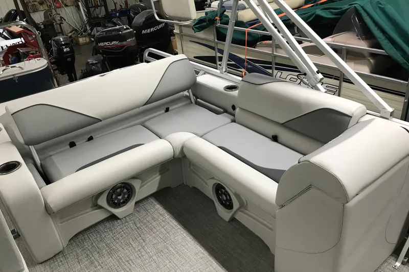 Slide: The Image of 2026 Avalon Venture 85 Versatile rear bench with gray and white seating in a showroom. - 9