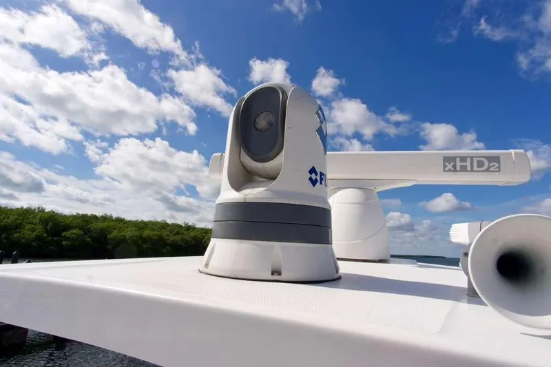 Slide: The Image of 2023 Blackfin 302 CC boat radar and camera system under a clear blue sky. - 25