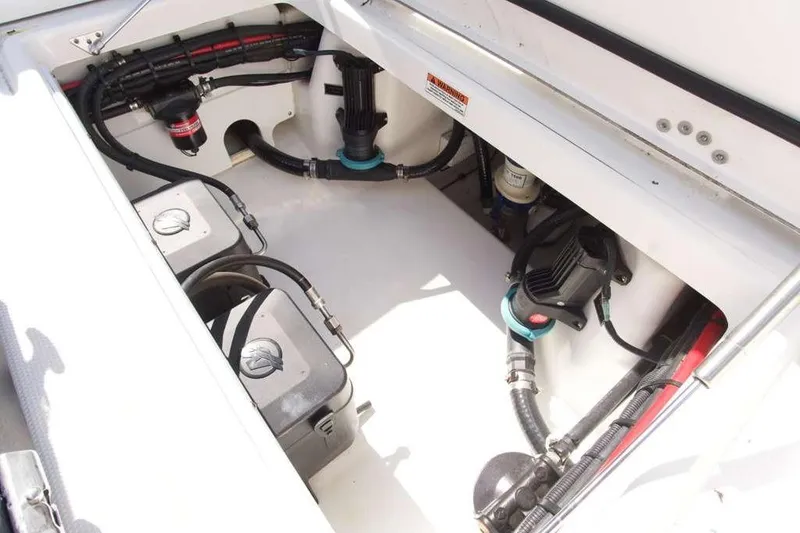Slide: The Image of 2023 Blackfin 302 CC boat engine compartment with wiring and components. - 37