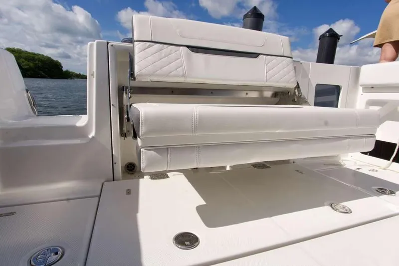 Slide: The Image of 2023 Blackfin 302 CC boat with white seating and open water view. - 39