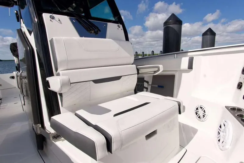 Slide: The Image of 2023 Blackfin 302 CC boat interior with white seating and modern design. - 4