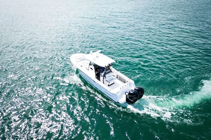 Slide: The Image of 2023 Blackfin 302 CC boat cruising on open water. - 9