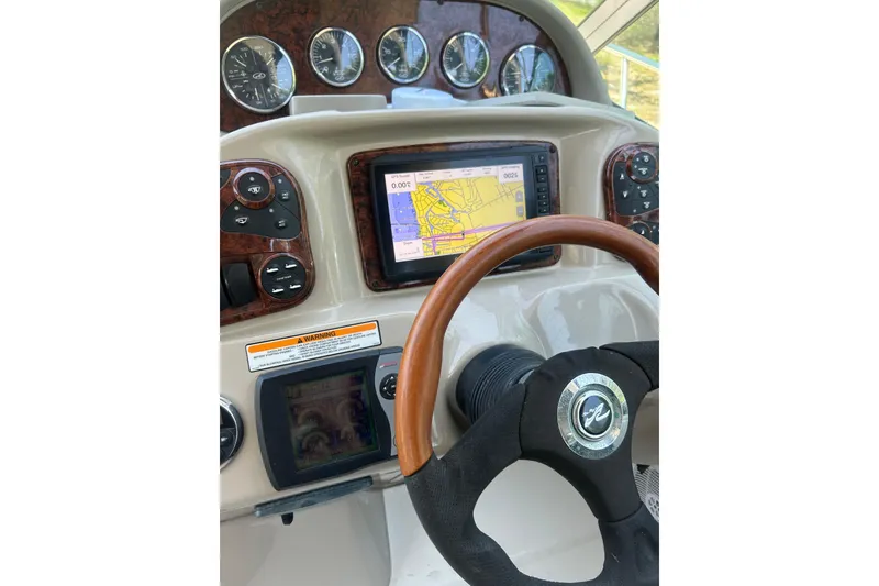 Slide: The Image of Helm of 2006 Sea Ray 300 Sundancer with GPS and gauges. - 13