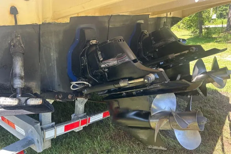 Slide: The Image of 2006 Sea Ray 300 Sundancer boat propellers and stern drive on trailer. - 21
