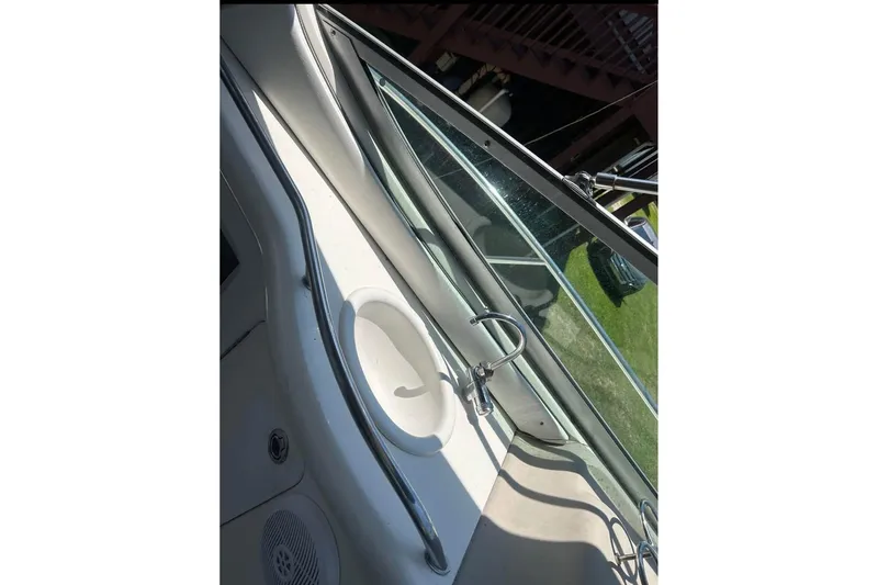 Slide: The Image of 2006 Sea Ray 300 Sundancer boat interior with sink and window view. - 22