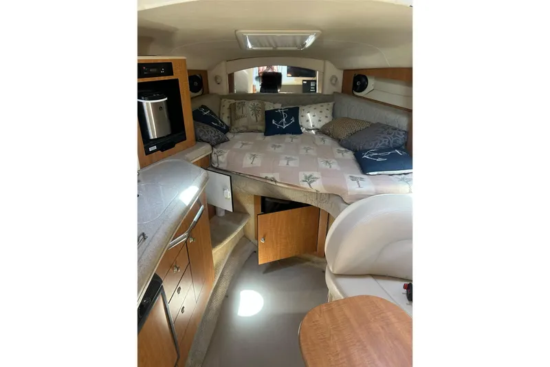Slide: The Image of Interior of 2006 Sea Ray 300 Sundancer with cozy cabin and kitchenette. - 26