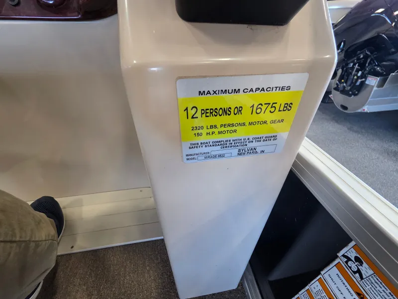 Slide: The Image of Sylvan Mirage 8522 boat capacity label, 12 persons or 1675 pounds. - 11