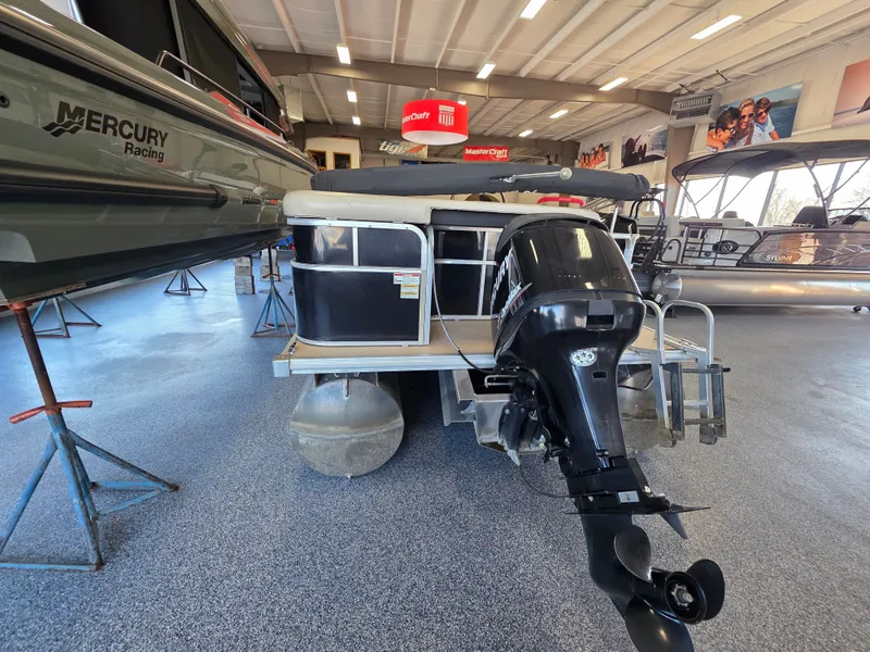 Slide: The Image of 2012 Sylvan Mirage 8522 pontoon boat in showroom. - 2