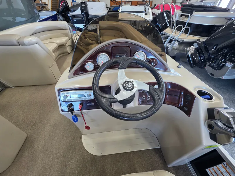 Slide: The Image of Cockpit of a 2012 Sylvan Mirage 8522 pontoon boat. - 8