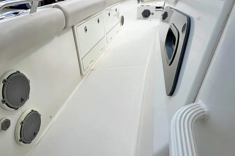 Slide: The Image of 2018 Boston Whaler 420 Outrage interior with storage compartments and speakers. - 12