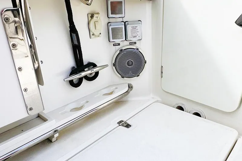Slide: The Image of Interior view of a 2018 Boston Whaler 420 Outrage boat, featuring controls and speaker. - 14