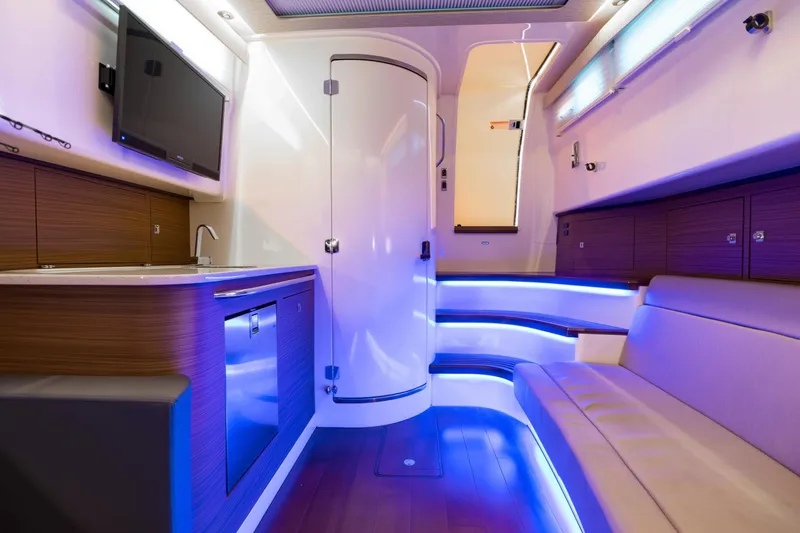 Slide: The Image of Luxurious interior of 2018 Boston Whaler 420 Outrage with modern amenities and ambient lighting. - 2