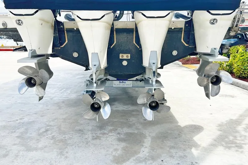 Slide: The Image of Rear view of 2018 Boston Whaler 420 Outrage with four powerful outboard engines. - 23