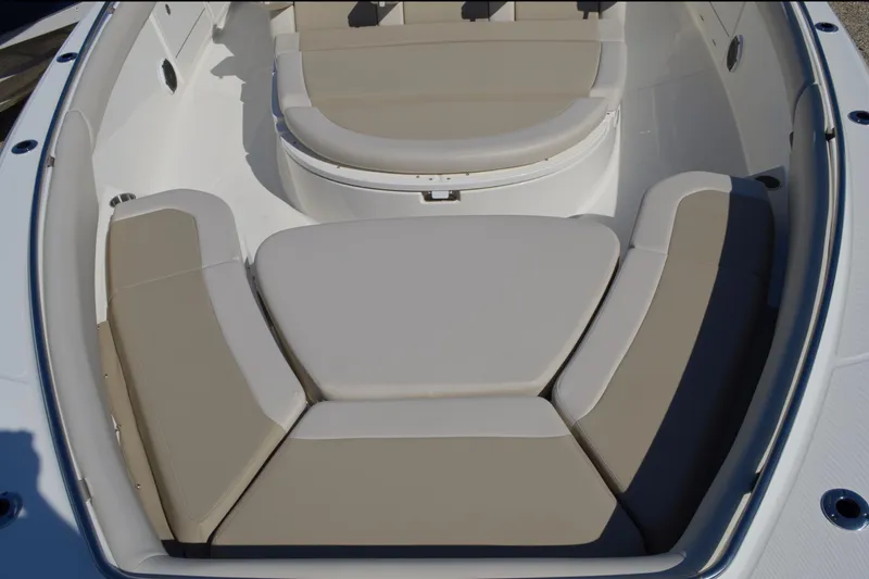 Slide: The Image of 2018 Boston Whaler 420 Outrage boat with beige cushioned seating area. - 5