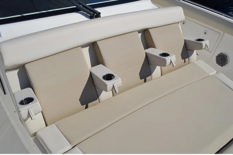 Slide: The Image of Luxury seating with cup holders on 2018 Boston Whaler 420 Outrage boat. - 6