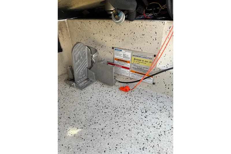 Slide: The Image of Boat foot pedal and capacity warning labels in Xpress X17 Pro, 2019 model. - 10