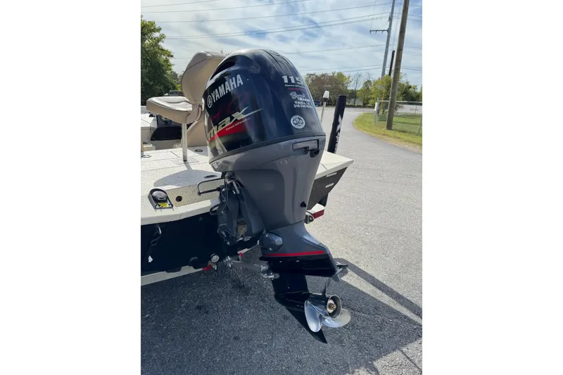 Slide: The Image of 2019 Xpress X17 Pro boat with Yamaha 115 outboard motor on a sunny day. - 2