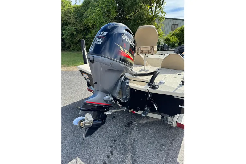 Slide: The Image of 2019 Xpress X17 Pro boat with Yamaha 115 outboard motor, parked outdoors. - 3