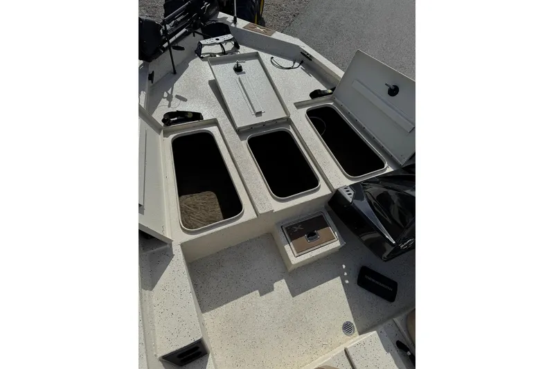 Slide: The Image of Xpress X17 Pro 2019 boat deck with open storage compartments and equipment. - 8