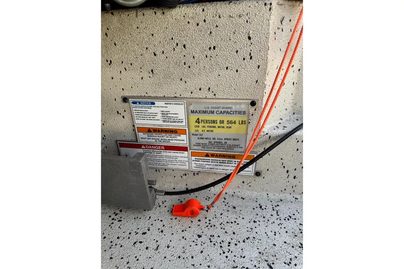 Slide: The Image of Boat capacity warning labels on Xpress X17 Pro, 2019 model, indicating maximum load and safety instructions. - 9