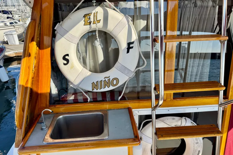 Slide: The Image of 1989 Bayliner 3288 Motoryacht with lifebuoy, sink, and ladder on deck. - 17